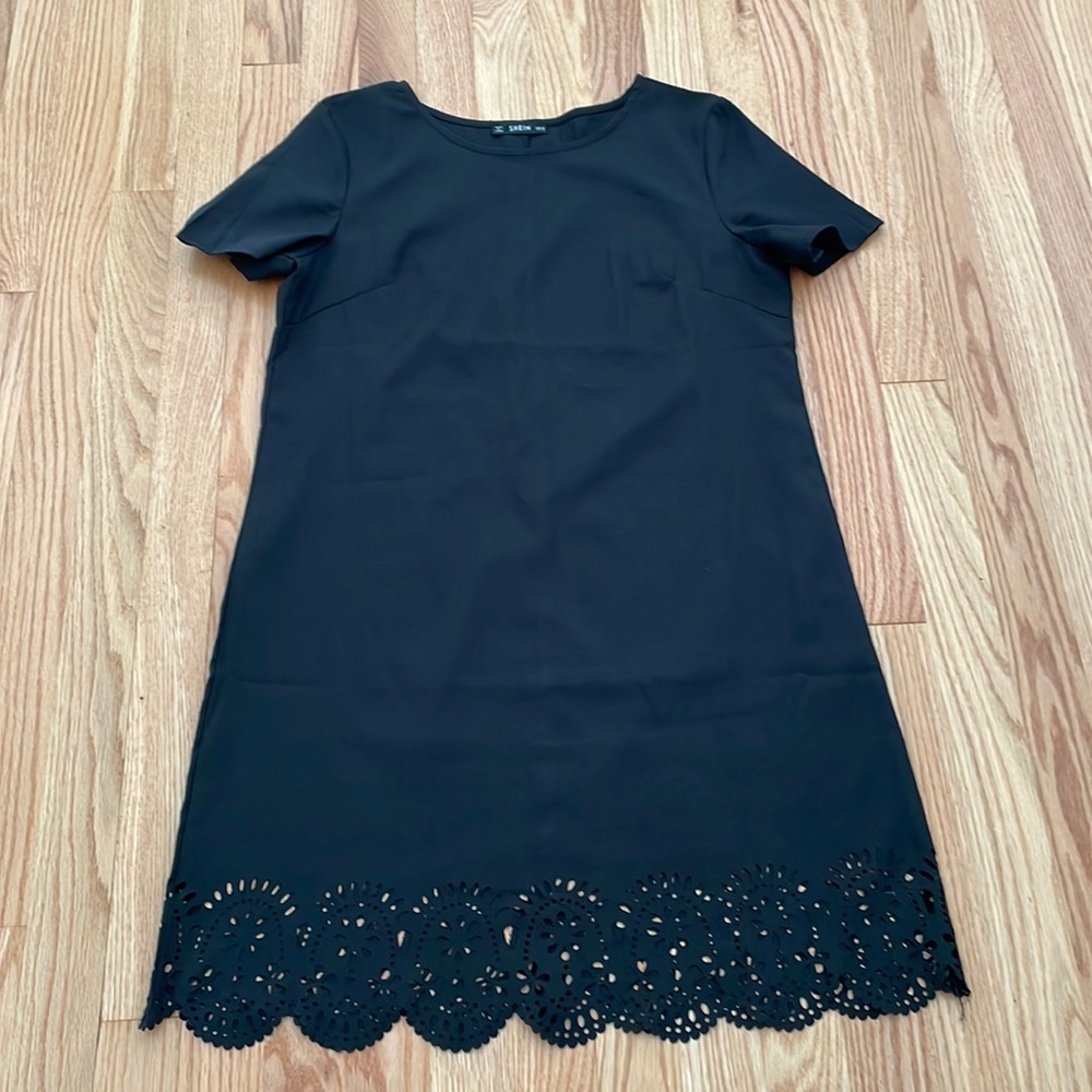 Cute black dress with cut outs on bottom